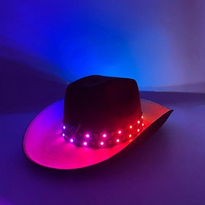 Detail of black cowboy hat with double-row LED lights glowing in purple pink color