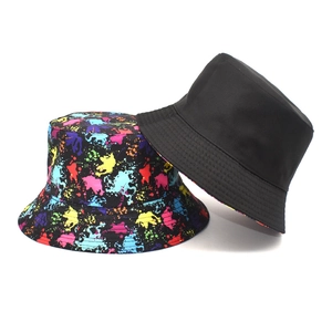 Detail of durable canvas bucket hats showing fine stitching and colorful splatter pattern
