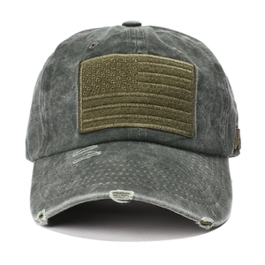Detailed close-up of distressed brim and tactical US flag embroidery on baseball cap