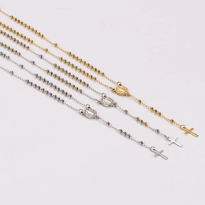 Three stainless steel rosary necklaces in gold and silver with Virgin Mary medals and crosses