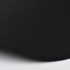 Detailed close-up showing the dense weave texture of the black beret fabric and brim