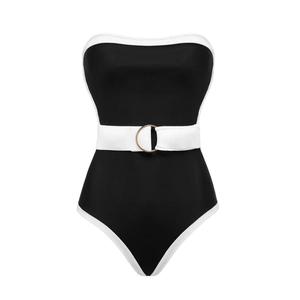 Minimalist black and white contrast one-piece swimsuit with belt and gold buckle