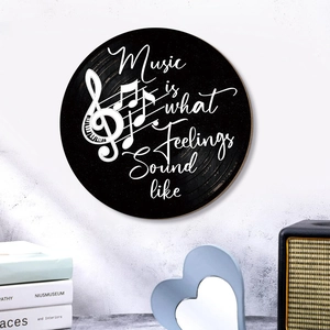 Modern black record-style wooden wall art with music quotes and musical notes