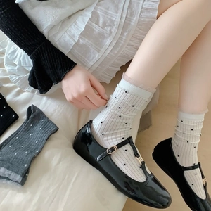 Bamboo fiber white polka dot crew socks with lace trim and black Mary Jane shoes
