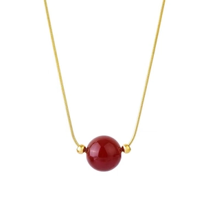 Titanium steel snake chain necklace with red agate bead pendant on white background