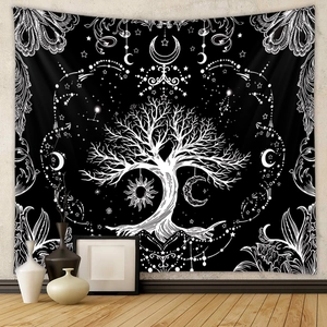 Detailed macro view of black and white tree of life tapestry hanging on a plain wall