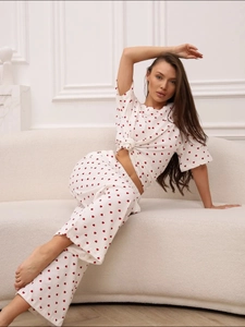 Cozy women's pajamas set with red heart print featuring short sleeve top and long pants