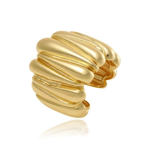 Macro shot of gold wide open ring with unique crushed ripple texture and metallic luster