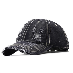 Distressed black denim baseball cap with vintage ripped details and contrast stitching