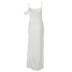 Detail view of the back of a white maxi dress with delicate straps and ruched waist detailing