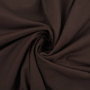Macro texture del tessuto a rete caffè scuro con eleganti pieghe a spirale per abito lungo