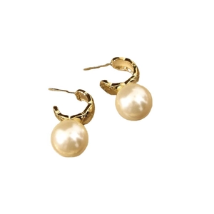 Elegant gold metal hoop earrings with large white pearls on a clean white background