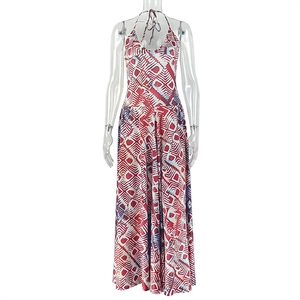 Close-up of red and white geometric print on deep V-neck halter long dress