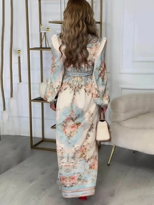 Elegant floral print maxi dress back view showing sophisticated silhouette and long sleeves
