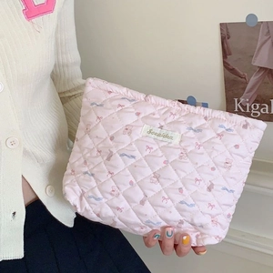 Pink quilted cosmetic bag with cute bear patterns and large capacity for travel storage