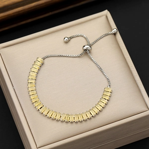 Detailed view of yellow rectangular zircon bracelet with adjustable silver box chain
