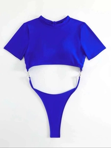 Close-up of electric blue bikini with silver metal rings and short sleeve design