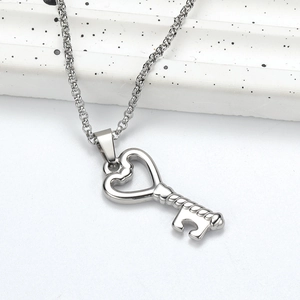 Minimalist silver irregular heart key pendant necklace with a polished metal chain link