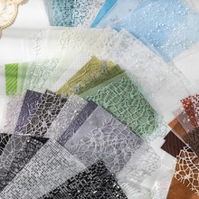 Close-up of assorted vintage decorative mesh and lace textures for gift packaging