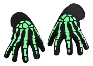 Detail of knitted Halloween skull gloves with glowing green skeletal hand pattern