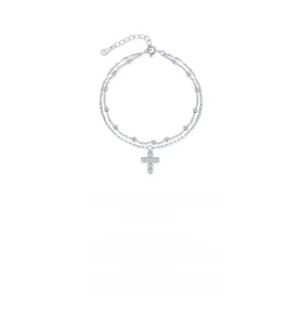 Macro detail of S925 sterling silver double-layer bracelet with sparkling cross charm