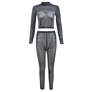 Detail of hollow out mesh set with black and white dynamic swirl pattern and crop top