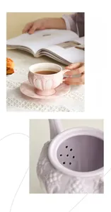 Detail of vintage embossed ceramic teapot with built-in tea filter and floral patterns