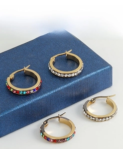 Detailed macro view of 18K gold-plated hoop earrings with sparkling clear and multicolor crystals