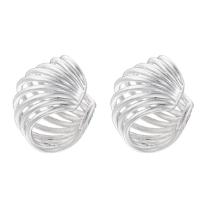 Macro view of silver C-shaped earrings with layered radiating shell patterns