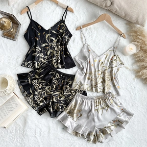 Women's ice silk floral pajama sets with camisole and ruffle shorts in black and champagne