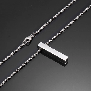 Polished silver titanium steel square pillar pendant necklace on a reflective black background