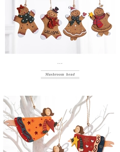 Close-up of wooden gingerbread man and angel ornaments with festive painted details