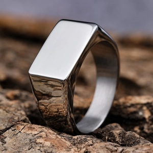 Minimalist silver stainless steel signet ring with a polished mirror finish surface
