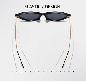 Detailed view of black cat-eye sunglasses with golden elastic metal temples design