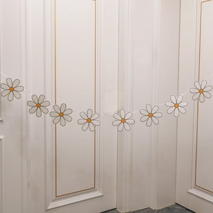 Daisy macaron birthday banner party decoration with white and yellow paper flowers