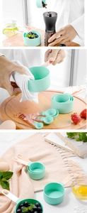 8-piece mint green measuring cups and spoons set with rose gold handles for baking
