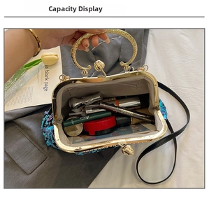 Detail view of sequined shell bag interior showing capacity for cosmetics and essentials