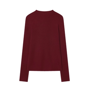 Detail view of the seamless back tailoring and smooth texture of this wine red knit sweater