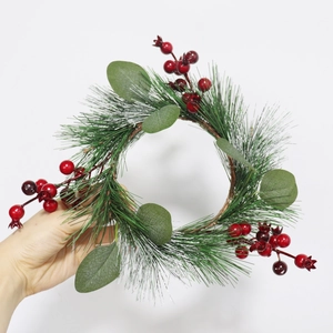 Artificial Christmas wreath with green pine needles, eucalyptus leaves and red berries