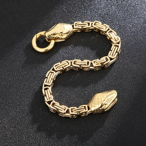 Detail of golden Byzantine chain bracelet featuring double snake head carvings