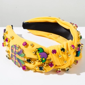 Détail d'un serre-tête Mardi Gras avec strass colorés et ornements de masque