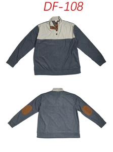 Detail of grey-blue and cream color block sweatshirt with corduroy texture and elbow patches