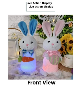 Close-up of glowing plush Easter bunnies with LED lights holding carrot and egg decorations