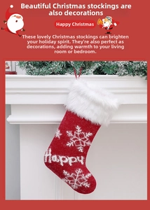 Close-up of red knitted Christmas stocking with white snowflake embroidery and faux fur trim