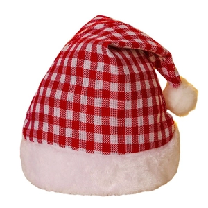 Classic red and white plaid Christmas hat with plush trim on a clean white background