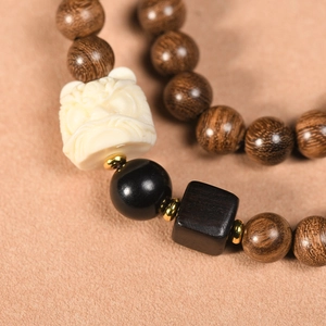 Golden Sandalwood buddhist prayer beads with lion head carving and metallic accents