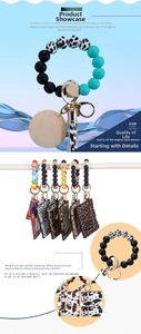 Detail of silicone bead wristlet keychain set with matching leopard print wallet card holder
