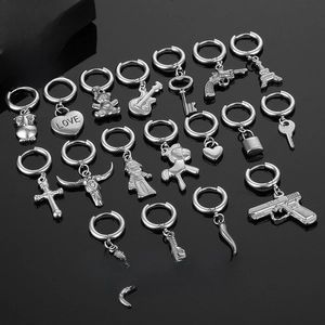 Detailed set of silver stainless steel earrings featuring gothic and bohemian charms