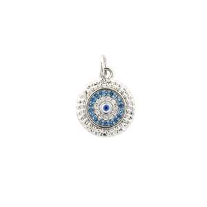 Detailed close-up of a silver Evil Eye charm with blue and clear cubic zirconia stones
