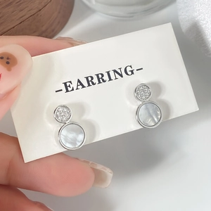 Elegant silver tiered earrings with zircon pavé and shimmering mother of pearl shell inlay